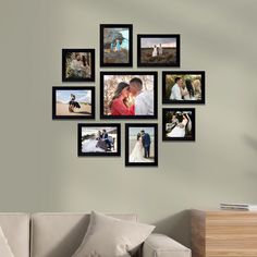 a living room with a couch and pictures on the wall above it's head