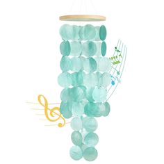 a wind chime with musical notes hanging from it's sides and green glass beads