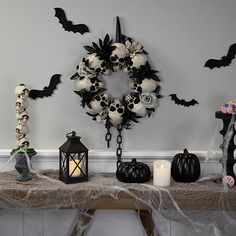 a table topped with lots of halloween decorations and decorating items on top of it