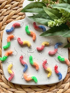 the beads are made to look like worms and have been placed on a plate