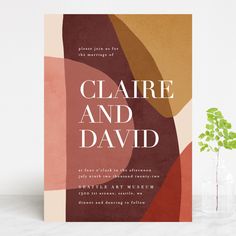 a card with the words claire and david on it next to a vase filled with flowers