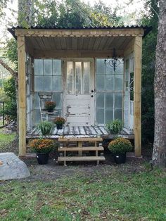 a white door sitting next to a wooden bench