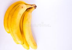 three ripe bananas on a white background stock images and clippings are included in this image