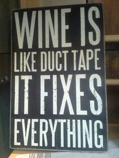 a sign that says wine is like duct tape it fixes everything