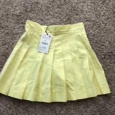 Small Fitted A-line Skort For Spring, Elegant A-line Skort For Spring, Spring Casual A-line Bottoms, Casual Skirted Skort For Spring, Trendy A-line Summer Bottoms, Casual A-line Pleated Skirt For Summer, Spring A-line Stretch Bottoms, Casual A-line Pleated Summer Skirt, Spring Stretch A-line Bottoms