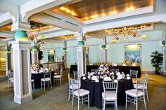 a banquet room set up with tables and chairs