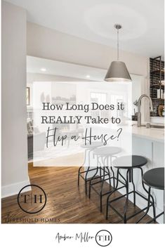 a kitchen with an island and bar stools next to it, which says how long does it really take to the house?