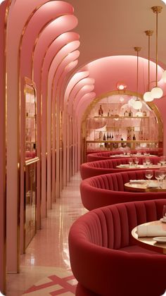 the interior of a fancy restaurant with pink walls