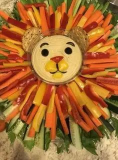 a lion made out of carrots, celery and other veggies