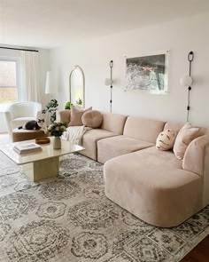 a living room filled with furniture and a large rug