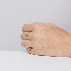 This gemstone stacking ring with peridot is made from solid 14k gold. This beautiful birthstone ring comes in yellow gold. This gold ring is made with real gold and real natural peridot. This peridot ring can be worn as a promise ring, engagement ring, stacking ring, or wedding ring. Add this gold ring to your collection now. Gold Stackable Rings For Everyday - May Birthstone, 14k Gold Signet Ring With Birthstone Open Shape, Yellow Gold Signet Ring With May Birthstone Gemstone, Gold Birthstone Ring In Recycled Gold, Adjustable Yellow Gold Emerald Birthstone Ring, Adjustable Yellow Gold Emerald Ring With Birthstone, Yellow Gold Signet Ring With May Birthstone, Minimalist Gold Stackable Rings For May Birthstone, Recycled Gold Round Birthstone Ring