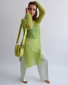 Hello, I'm the one, who won't let you down - lime green mohair tunic. I will comfort you, keep you warm and will make you smile. I'm 100% hand made and proud of that. I consist of 70% italian kid mohair and 30% of nylon, which makes me incredibly natural. I'm quite unique as could be worn all year long. I'm in one size and one size fits all because my measurements are : ❤️ Width -50 cm ❤️ Lengths -86 cm If you would like me in other size, you could request a custom order with your own parameters Green Layering Sweater For Spring, Trendy Green Open Knit Sweater, Oversized Open Knit Green Sweater, Oversized Green Open Knit Sweater, Oversized Green Sweater For Spring, Green Mohair Knitted Sweater, Chic Fine Knit Green Sweater, Long Green Knit Sweater, Spring Casual Mohair Sweater