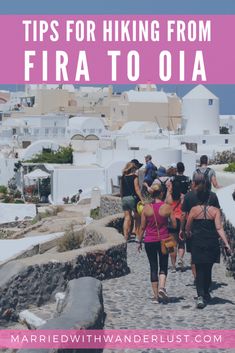 people walking down a cobblestone road with text overlay reading tips for hiking from fira to oia