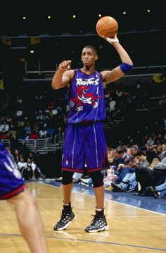 a basketball player is about to dunk the ball