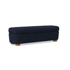 an upholstered bench with wooden legs and dark blue fabric, against a white background