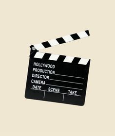 a black and white clapper with the words hollywood written on it