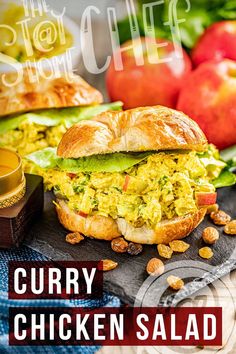 an advertisement for curry chicken salad sandwich with apples and other food items in the background