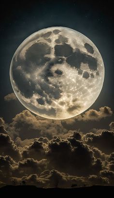 the full moon is shining brightly in the night sky above some fluffy clouds and trees