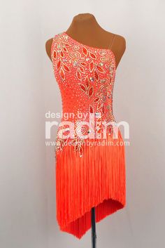 a mannequin with an orange dress on it's head and fringes