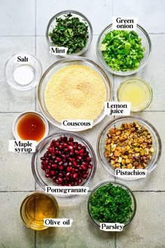 the ingredients for this recipe are shown in separate bowls and labeled on each side, including broccoli, cranberries, pine nuts, parsley, lemon juice, mustard,