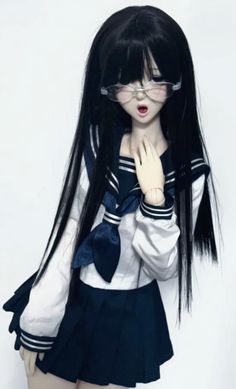 a girl with long black hair wearing glasses and a sailor outfit is posing for the camera