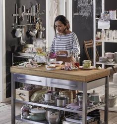 a woman is preparing food in her kitchen