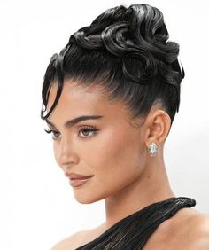 a woman with short black hair wearing an updo and diamond earrings on her head