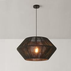 a light hanging from the ceiling in a room