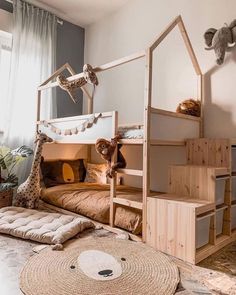 a child's bedroom with bunk beds and stuffed animals