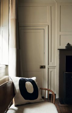 a living room filled with furniture and a fire place