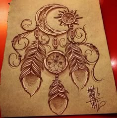 a drawing of a dream catcher with the moon and stars on it's back