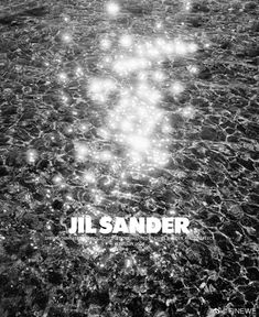 a black and white photo with the words jil sander in it's center