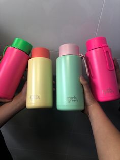 thermos are lined up in different colors