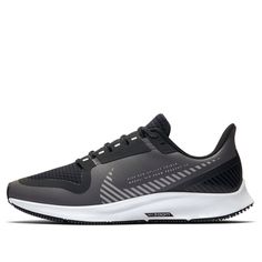 men's nike air zoom running shoes in grey and black with white soles