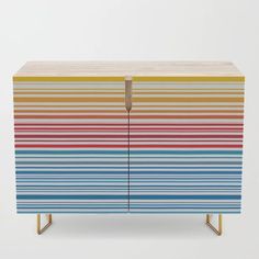 a multicolored wooden cabinet with two doors