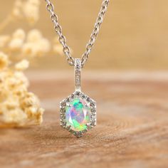 **Next-Day Shipping with Valid Tracking Number** White opal necklace, necklace for women, fire opal jewelry, October birthstone opal jewelry, Rainbow fire opal necklace, pendant necklace for her, Genuine fire opal jewelry. - D E T A I L S - * Gemstone - Ethiopian opal  * Birthstone - October birthstone  * Stone Size - 5 x 7 MM Approx. * Stone Shape - Oval * Color - White  * Base Material - 925 Sterling Silver * Finish - 14K Gold Filled * Quality - AAA Grade Quality **Next-Day Shipping with Track Ethiopian Opal Jewelry, Fire Opals Jewelry, Opal Birthstone, Fire Opal Necklace, Rainbow Fire, Opal Pendant Necklace, Necklace Necklace, October Birthstone, Opal Pendants