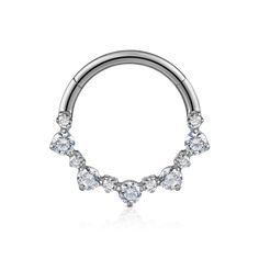 a silver nose ring with four stones on the top and two rows of diamonds at the bottom