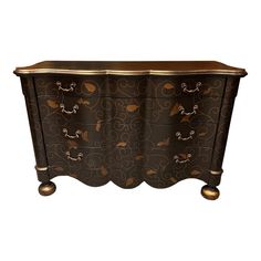 an ornately decorated chest of drawers on wheels