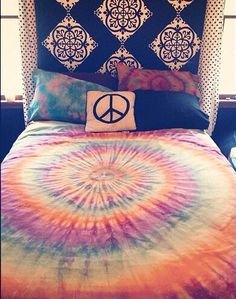 a bed with a peace sign on it