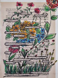 an old book page with flowers and words written on the pages, in different colors