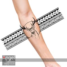 an arm tattoo with a deer on it's head and arrows in the middle