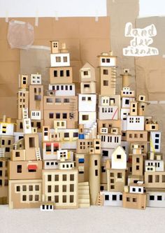 cardboard city buildings are stacked on top of each other