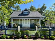 a house with a picket fence in front of it