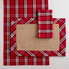 red plaid placemats with burlap border and jute mat on white background