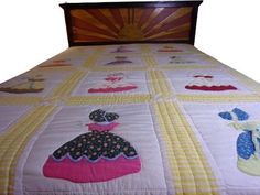 a quilted bedspread with different designs on it