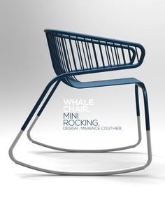 a blue chair sitting on top of a metal frame with the words whale chair in front of it