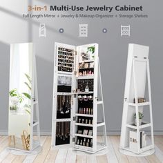 three tall white jewelry cabinets with mirrors on the sides and shelves in front of them