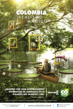 a man in a boat floating on top of a river next to trees and plants