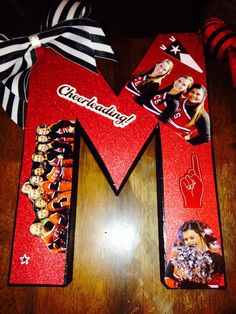 the letter m is decorated with pictures of cheerleaders and their name on it