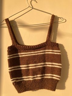 This unique hand knitted crop top is brown and it has two white lines on it. It fits for S and M sizes perfectly. Fitted Brown Knit Crop Top, Brown Fitted Knit Crop Top, Summer Brown Knit Crop Top, Casual Brown Knit Crop Top, Brown Fitted Crop Top, Top Marron, Knitted Crop Top, White Knit Top, Sweater Crop